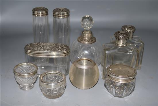 A pair of Edwardian silver mounted glass scent bottles and eight other silver mounted items.